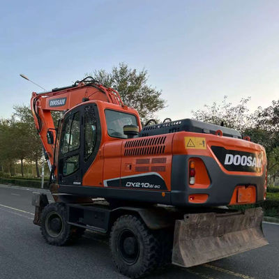 Doosan DX210W प्रयुक्त पहिया खुदाई हाइड्रोलिक मिनी सेकंड हैंड खुदाई 20100 किलो